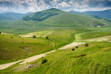 Obraz premium Piano Grande di Castelluccio, mountain and rural landscape