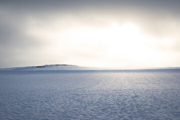 Field of snow with sky