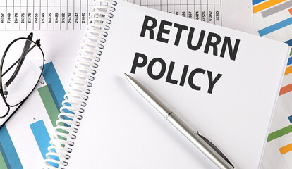 RETURN POLICY text , pen and glasses on the chart,business concept