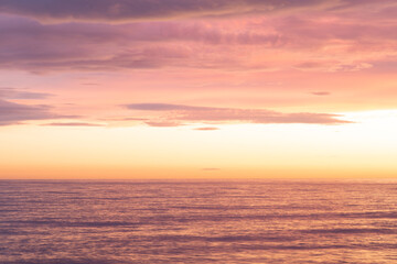 Naklejka na ściany i meble Breathtaking sea sunset with violet and golden colors. 