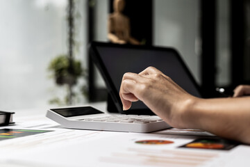 The company's finance manager is using a calculator, he uses a calculator to calculate the numbers in the company's financial documents that employees in the department create as meeting documents.