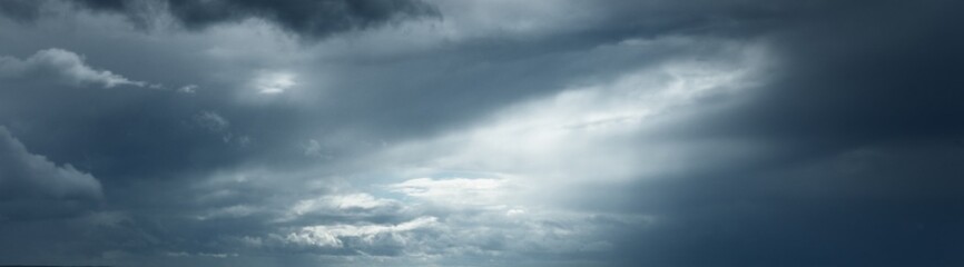 Dark ornamental clouds. Dramatic sky. Epic storm cloudscape. Panoramic image, texture, background,...