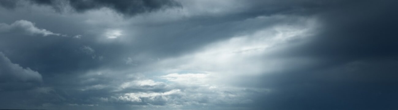 Dark ornamental clouds. Dramatic sky. Epic storm cloudscape. Panoramic image, texture, background, graphic resources, design, copy space. Meteorology, weather, thunderstorm. hurricane concepts