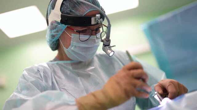 woman doctor is performing endoscopic operation in modern clinic