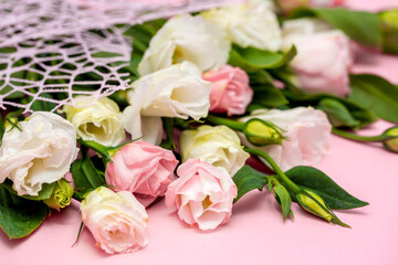Festive bouquet of flowers for the beloved on a pink background. The concept of love...
