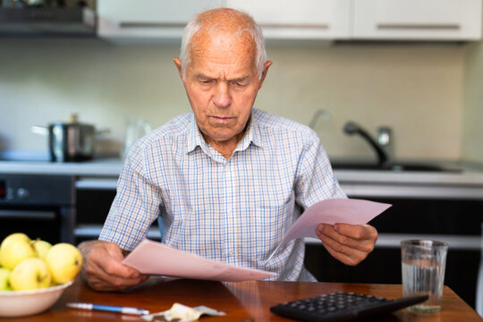 Senior man and utility bills