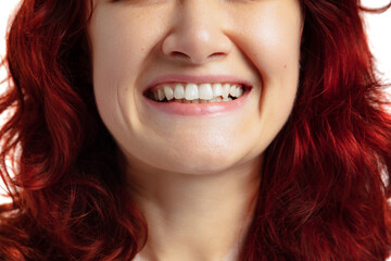 Close-up of open smiling female mouth without lips makeup. Cosmetology, medicine, dental health. Detailed.