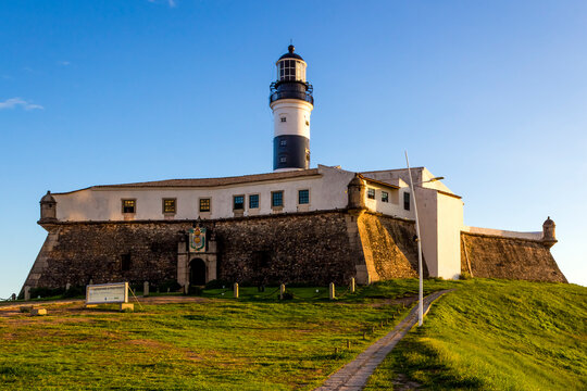 The iconic architecture of Farol da Barra lighthouse in Salvador, Bahia, Brazil.