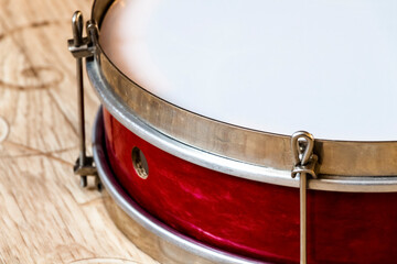 Fototapeta na wymiar Pioneer red snare drum close-up. Former USSR.