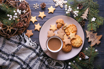Composition with spruce branches on a wooden background. Christmas composition.