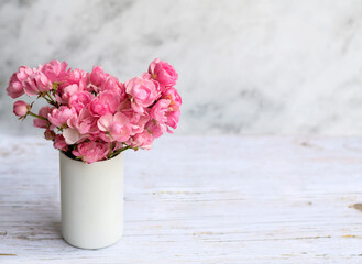 Beautiful Pink Roses Bouquet  on a White textured Background  