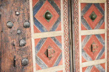 Abstract closeup detail view of decorative medieval wood metal door
