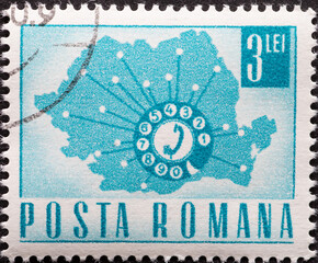 Romania - circa 1967: A post stamp printed in Romania showing a Telephone dial and map of Romania