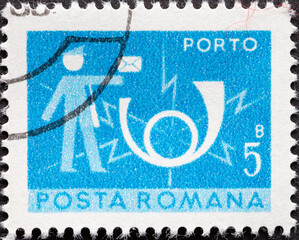 Romania - circa 1974: A post stamp printed in Romania showing a postman with a letter and a post...
