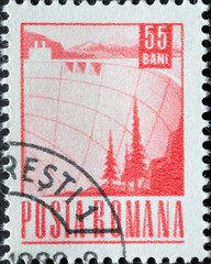Romania - circa 1969: A post stamp printed in Romania showing a Reservoir dam
