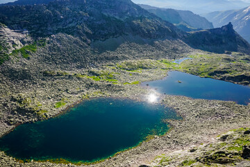 Fototapeta na wymiar Two beautiful mountain lakes in the Ergaki Natural Park