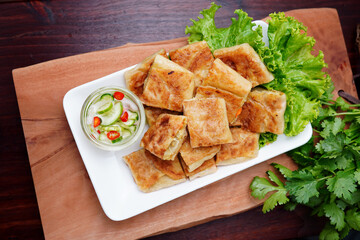 Mutabbaq Roti, Pancakes Stuffed with Beef or fried bread, cut into pieces