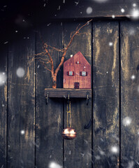 new year concept.wooden housekeeper on which christmas decoration hang
