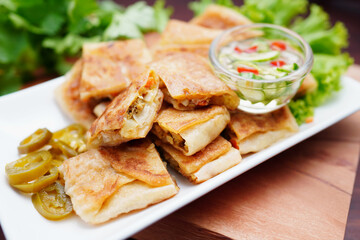 Mutabbaq Roti, Pancakes Stuffed with Beef or fried bread, cut into pieces