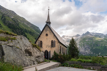 Fototapeta na wymiar Anglican chapel in the hamlet of Gletsch near Oberwald