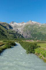 Rhone Valley near the hamlet of Gletsch with the Rhone River in front of the Rhone Glacier