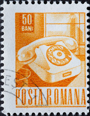 Romania - circa 1968: A post stamp printed in Romania showing a rotary telephone