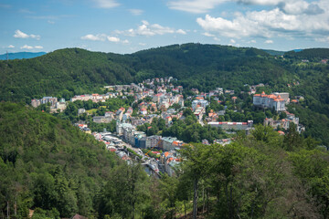 Karlovy Vary, Czech Republic, June 2019 - Beautiful panoramic view of Karlovy Vary from a viepoint at one of it's hills - obrazy, fototapety, plakaty