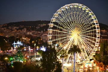 Voilages Nice Christmas Market and decorations and funfair Ferris wheel. Nice, France
