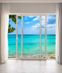 Fototapeta na wymiar large glass door overlooking the beach