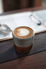 Selective focus cup of hot latte art coffee