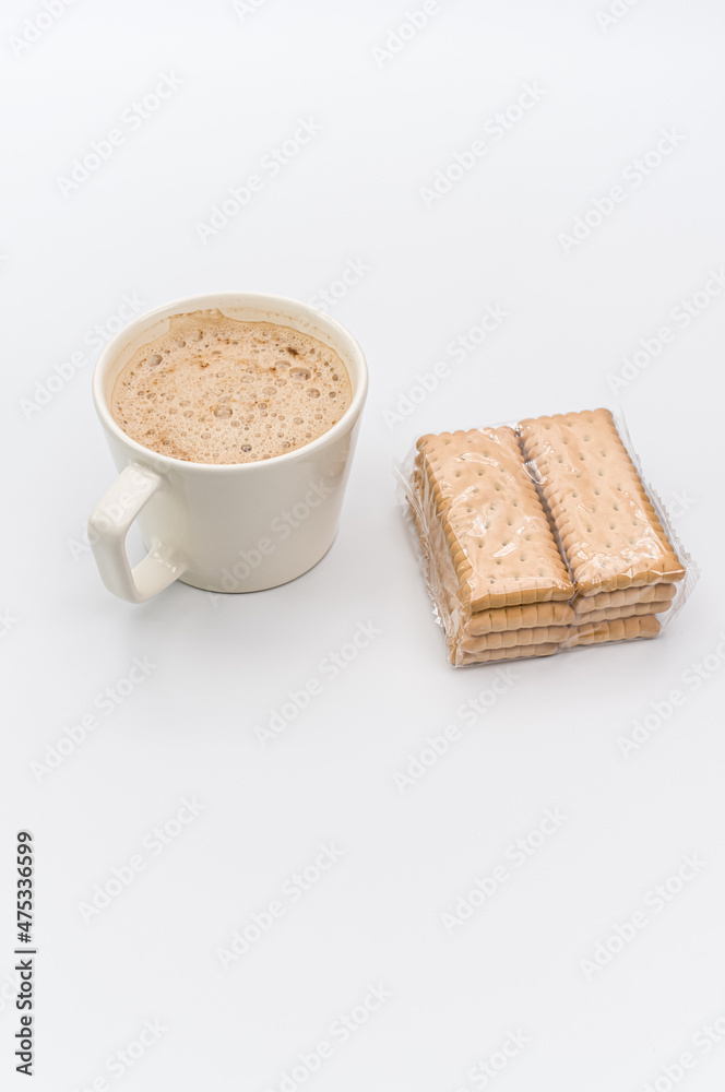 Canvas Prints delicious hot vegan Cappuccino with foam in a white cup and packaged biscuits on a white background