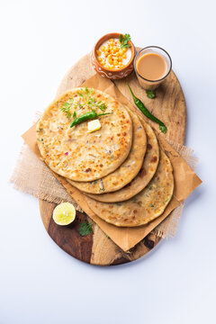 Paneer paratha is a popular North Indian flatbread made with whole wheat flour dough and stuffed with savory, spiced, grated paneer