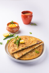 Paneer paratha is a popular North Indian flatbread made with whole wheat flour dough and stuffed with savory, spiced, grated paneer