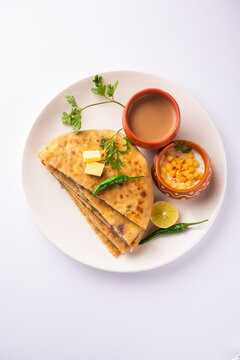 Paneer paratha is a popular North Indian flatbread made with whole wheat flour dough and stuffed with savory, spiced, grated paneer