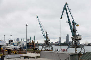 Fototapeta premium Batumi, Georgia - June 26, 2021: View of the seaport of Batumi. Port cranes. 