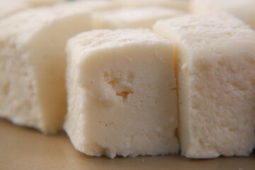 Fototapeta na wymiar close up of fresh cheese on white background.