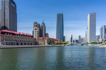 Fototapeta na wymiar Bridge,City scenery and modern architecture skyline by the Haihe River in Tianjin, China