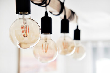 Close up on ceiling in row hanging led vintage bulbs