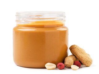 Peanut butter in a jar with peanuts on a white background. Isolated