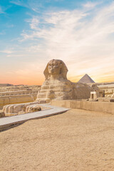 Great Sphinx against the background of the pyramids of the pharaohs Cheops, Khafren, and Mikerin in...