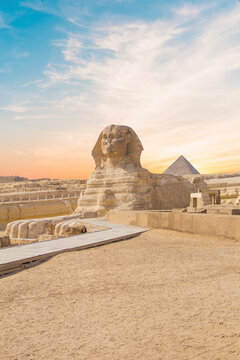 Great Sphinx against the background of the pyramids of the pharaohs Cheops, Khafren, and Mikerin in Giza, Egypt