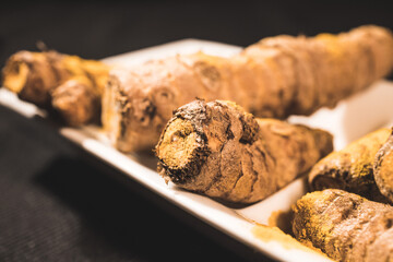 Ginger Roots on a dark background.