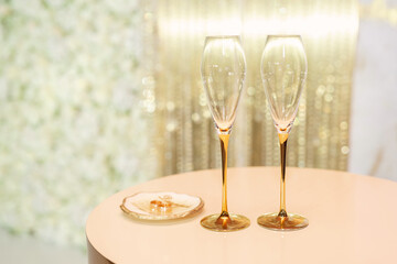 Bride and groom champagne glasses at a wedding reception.