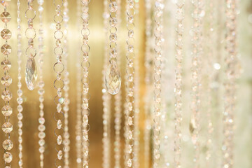 Naklejka na ściany i meble Hanging glass and shiny beads are an element of the wedding decor.