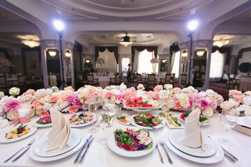 Served wedding banquet table with dishes in the restaurant