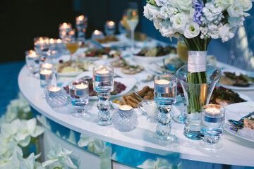 Served wedding banquet table with dishes in the restaurant