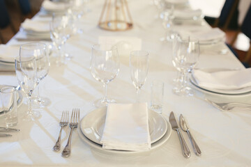 Beautiful setting of the wedding banquet table in the restaurant.