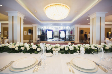 Beautiful setting of the wedding banquet table in the restaurant.