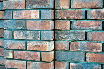 Fototapeta premium red old brick wall background, brick wall texture, structure. old broken brick, cement joints, close-up.