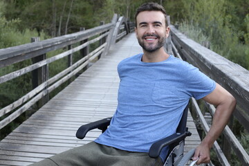 Optimistic man on a wheelchair representing diversity